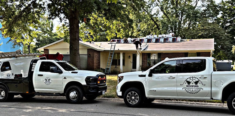 Worker with an orange vest and hard hat inspecting a residential roof